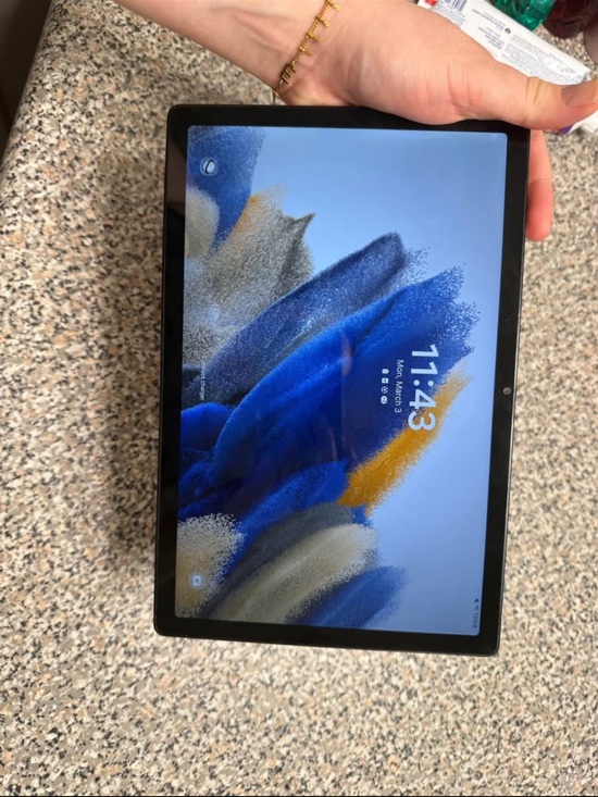 Samsung Tablet with Black Bezel and Blue Accent Display